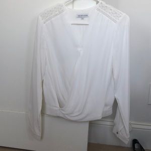 White blouse with flattering details (drape, lace)